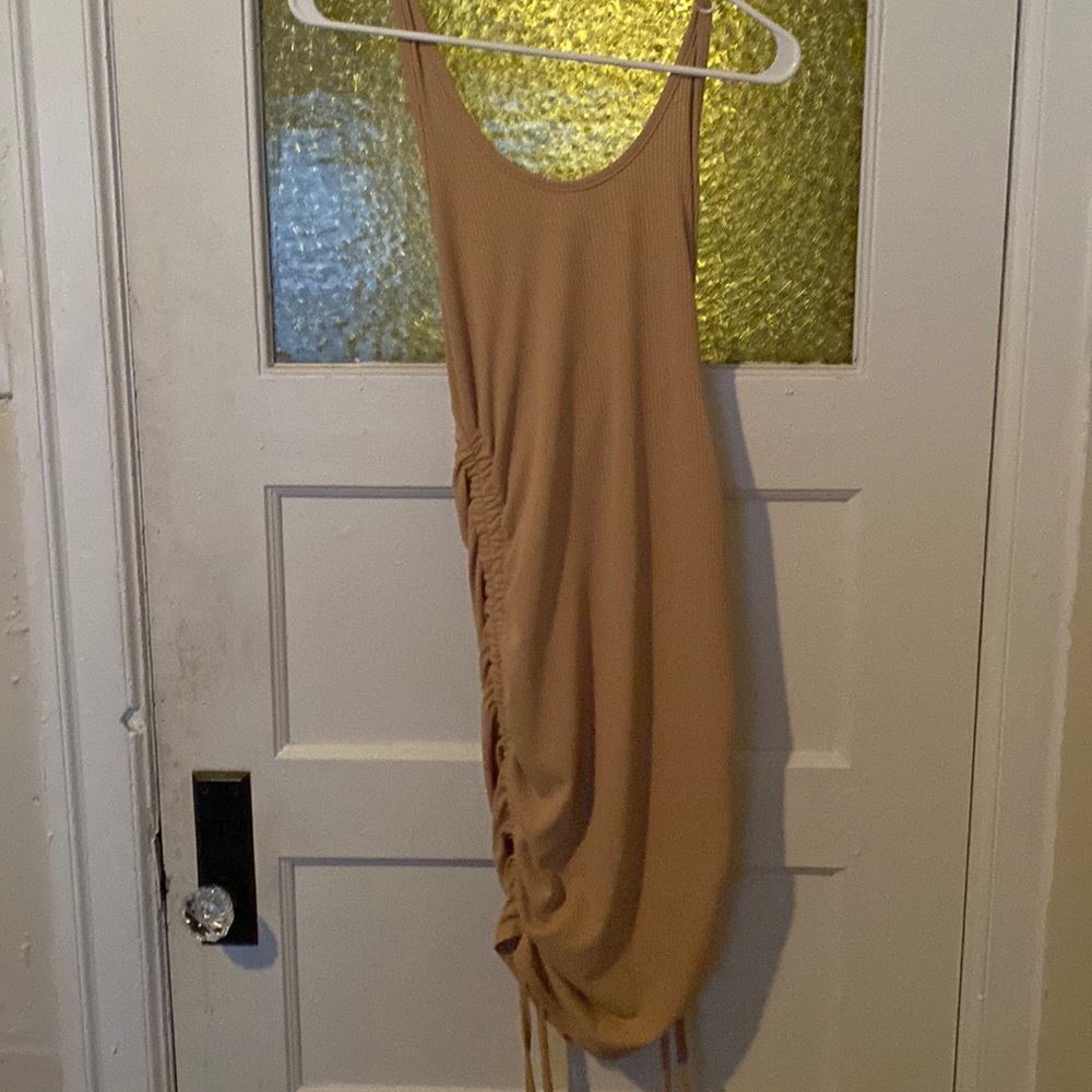 A nude drawstring dress
